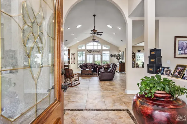 a living room with furniture potted plant and a fireplace