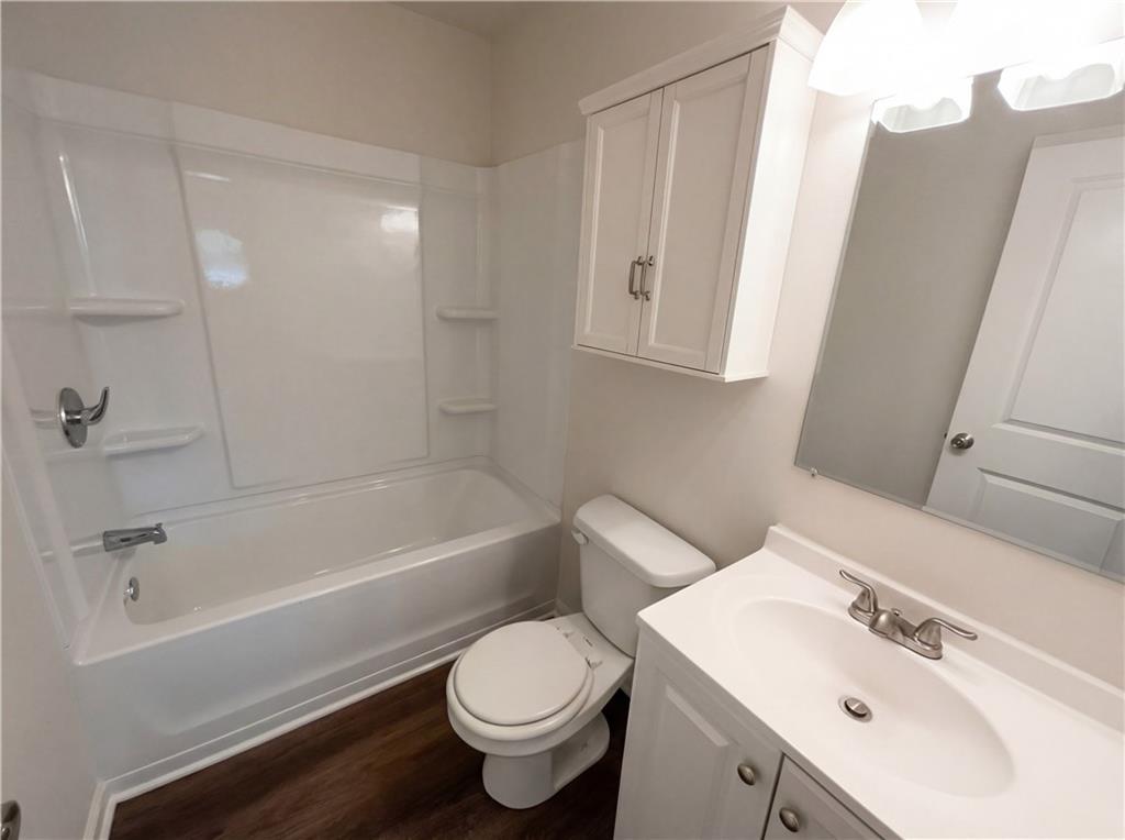 161 Grove Road Locust Grove, GA 30248 - Photo 12 of 18 a bathroom with a sink toilet and shower