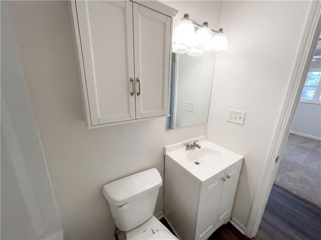 161 Grove Road Locust Grove, GA 30248 - Photo 13 of 18 a bathroom with a toilet sink and mirror