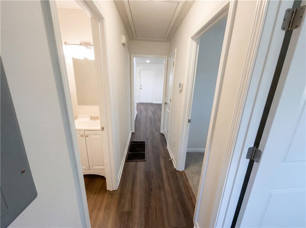 161 Grove Road Locust Grove, GA 30248 - Photo 14 of 18 a view of a hallway with wooden floor and staircase