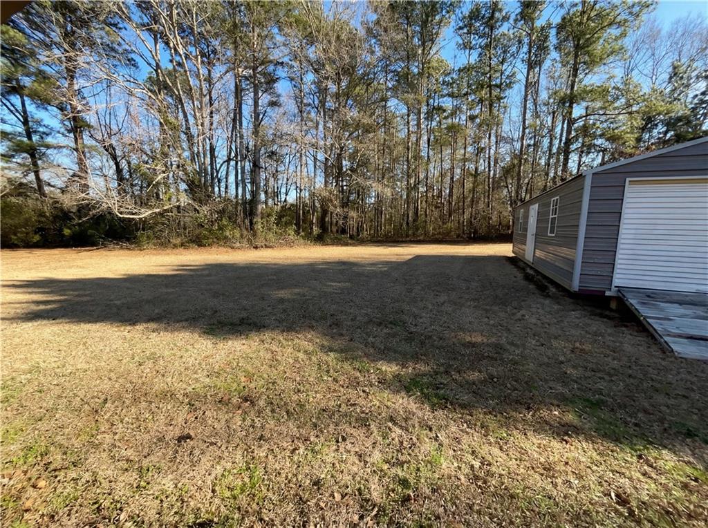 161 Grove Road Locust Grove, GA 30248 - Photo 17 of 18 a view of back yard of the house