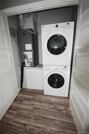 a view of a storage and utility room with washer and dryer