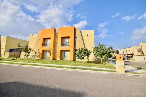 a view of a building with a street