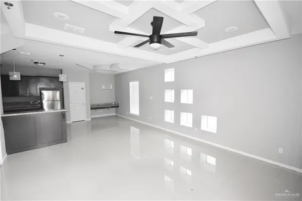 a view of a kitchen with a sink and a window