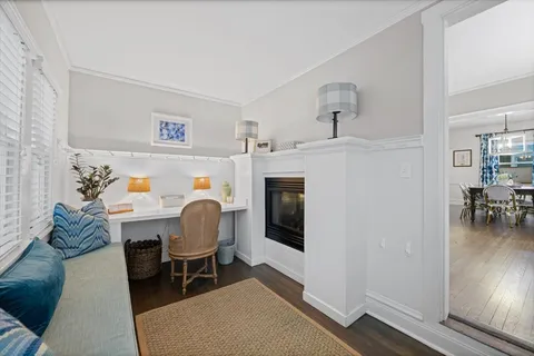 a work room with furniture and a fireplace