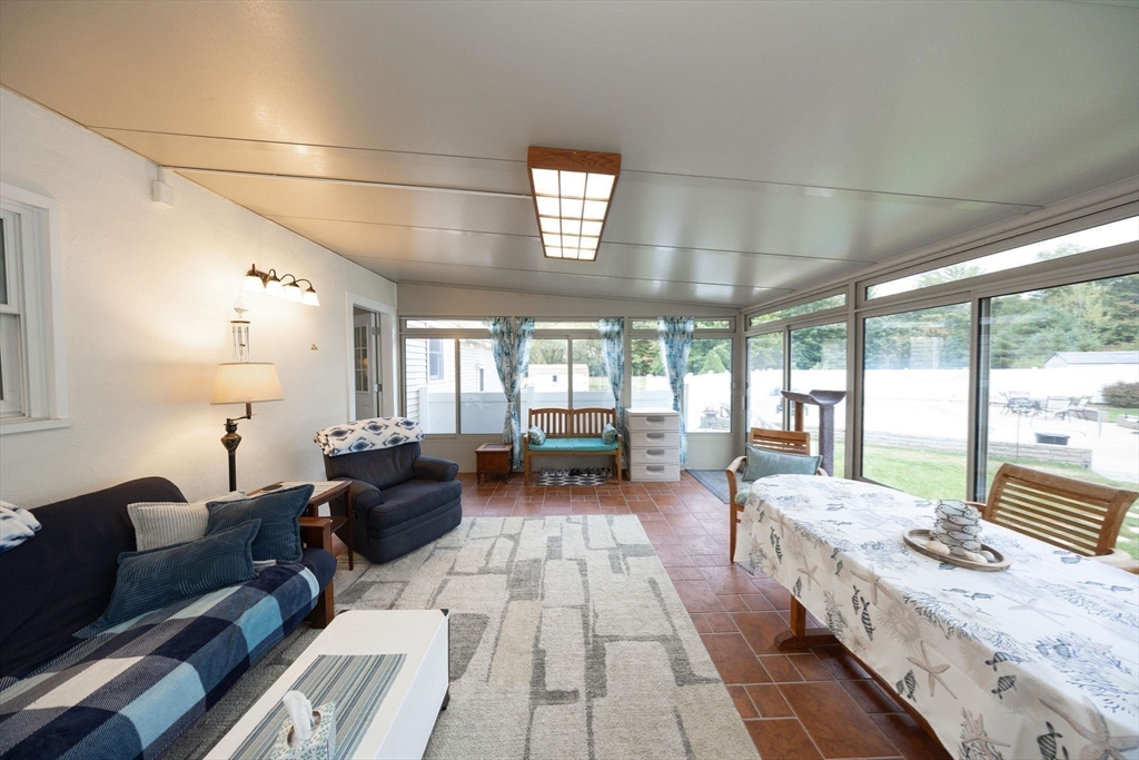 49 Dennis Whitney Road Oakham, MA 01068 - Photo 11 of 40 a living room with furniture and a large window