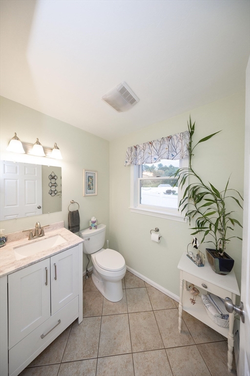 49 Dennis Whitney Road Oakham, MA 01068 - Photo 12 of 40 a spacious bathroom with a double vanity sink a mirror and a toilet