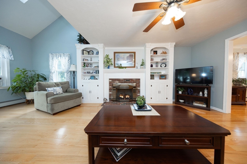 49 Dennis Whitney Road Oakham, MA 01068 - Photo 18 of 40 a living room with furniture a flat screen tv and a fireplace