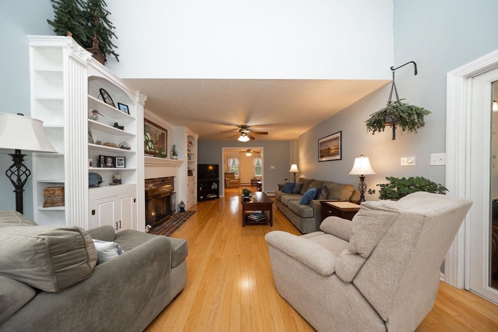 49 Dennis Whitney Road Oakham, MA 01068 - Photo 19 of 40 a living room with furniture a fireplace and a potted plant