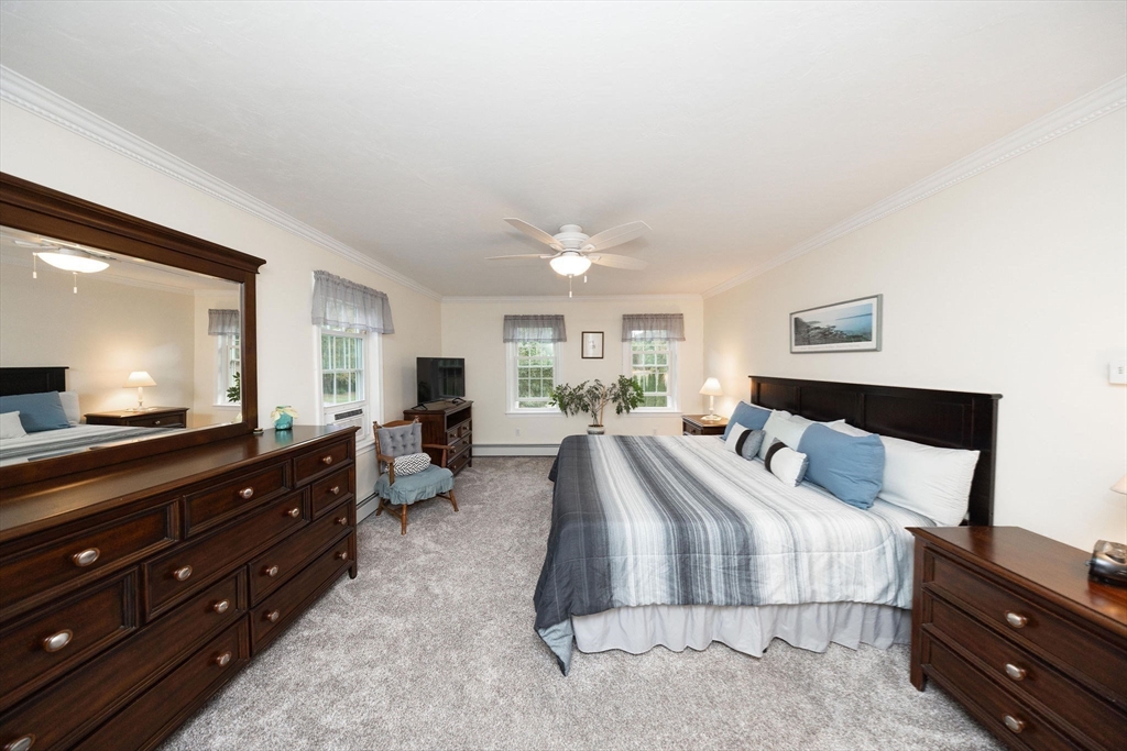 49 Dennis Whitney Road Oakham, MA 01068 - Photo 20 of 40 a bed room with a bed and a television