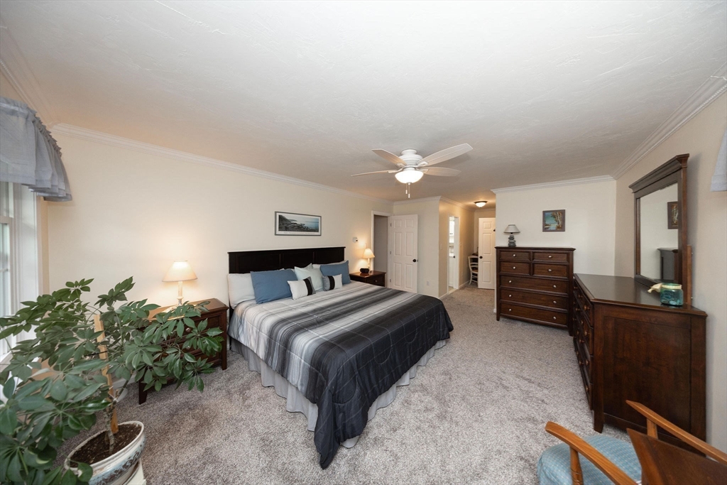 49 Dennis Whitney Road Oakham, MA 01068 - Photo 21 of 40 a bedroom with a bed and furniture