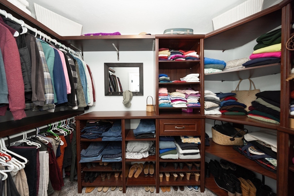 49 Dennis Whitney Road Oakham, MA 01068 - Photo 22 of 40 a view of walk in closet with clothes and shoes