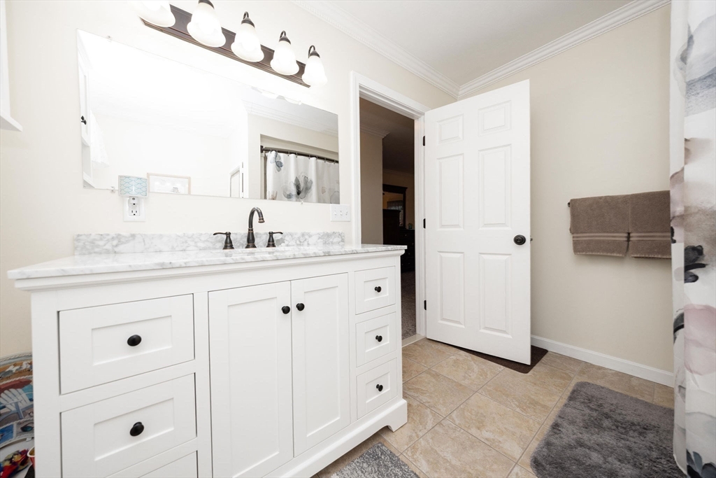49 Dennis Whitney Road Oakham, MA 01068 - Photo 23 of 40 a bathroom with a sink vanity and mirror