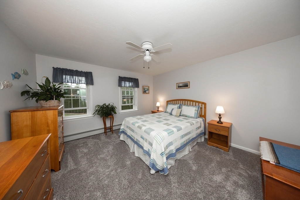 49 Dennis Whitney Road Oakham, MA 01068 - Photo 25 of 40 a bedroom with a bed and a couch