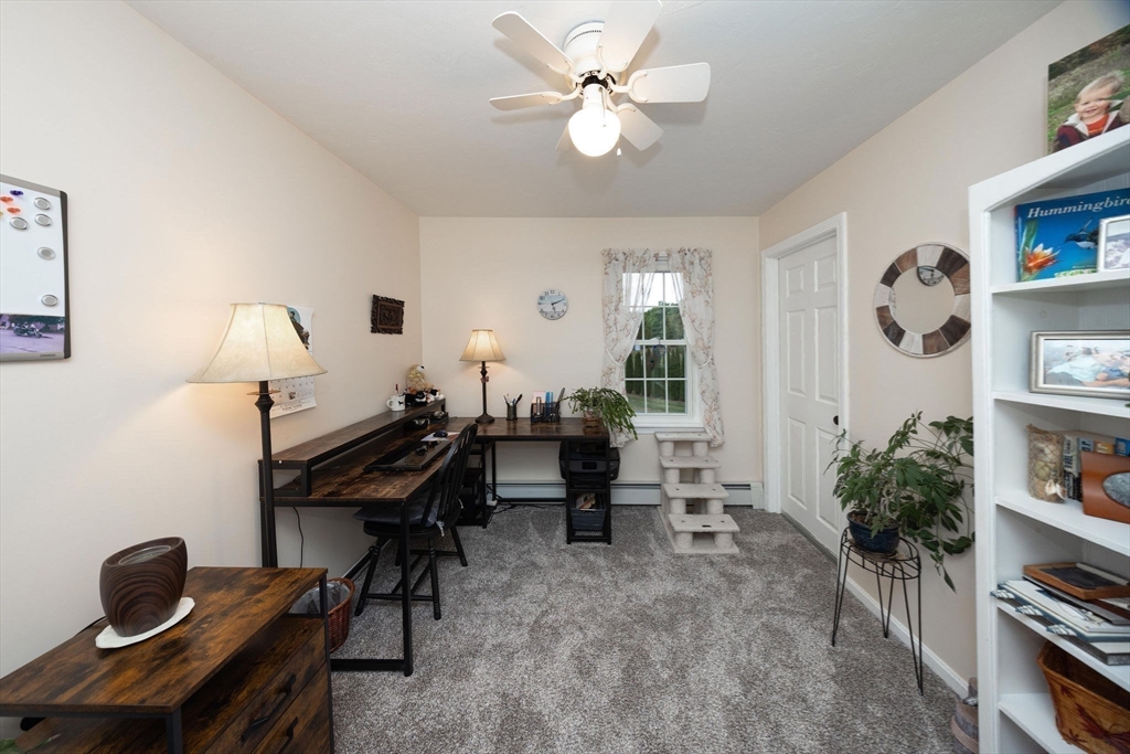 49 Dennis Whitney Road Oakham, MA 01068 - Photo 26 of 40 a view of a workspace with furniture and a window