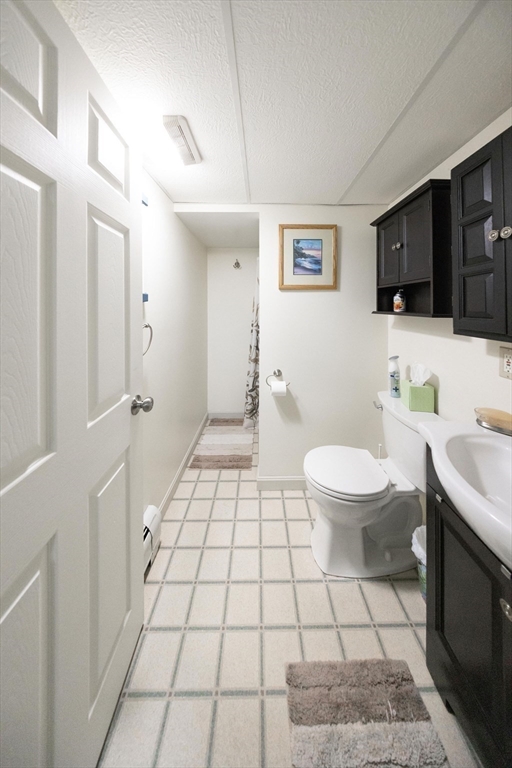 49 Dennis Whitney Road Oakham, MA 01068 - Photo 31 of 40 a bathroom with a sink toilet and shower