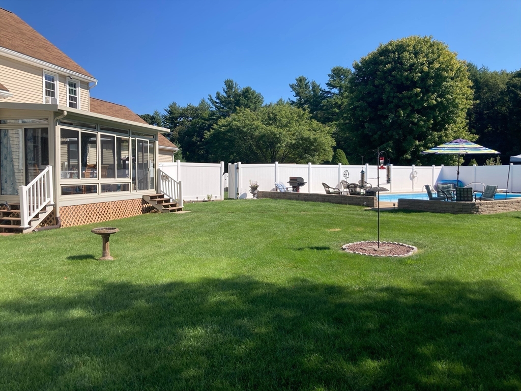 49 Dennis Whitney Road Oakham, MA 01068 - Photo 35 of 40 a view of a house with a yard and sitting area