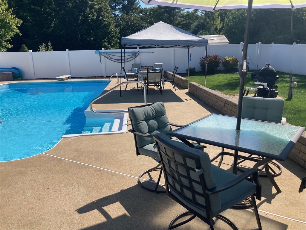 49 Dennis Whitney Road Oakham, MA 01068 - Photo 36 of 40 a view of an outdoor sitting area with furniture and backyard