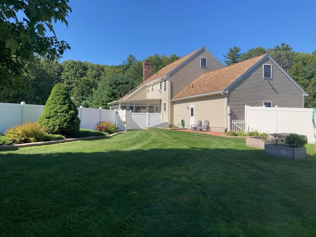 49 Dennis Whitney Road Oakham, MA 01068 - Photo 40 of 40 a front view of house with yard and green space