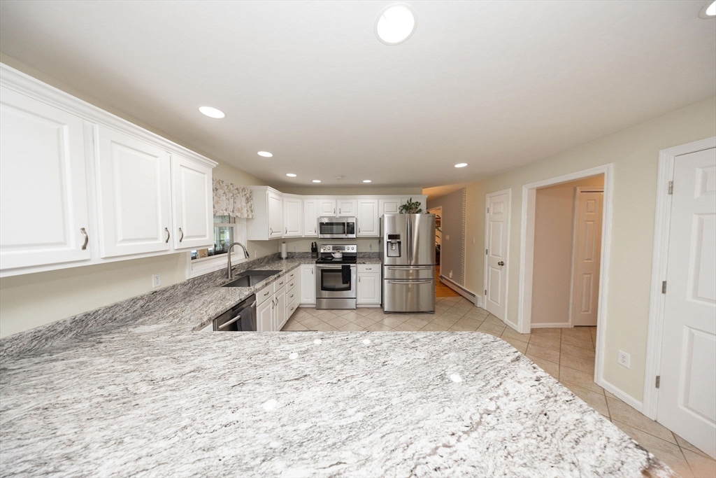 49 Dennis Whitney Road Oakham, MA 01068 - Photo 8 of 40 a view of kitchen and wooden floor