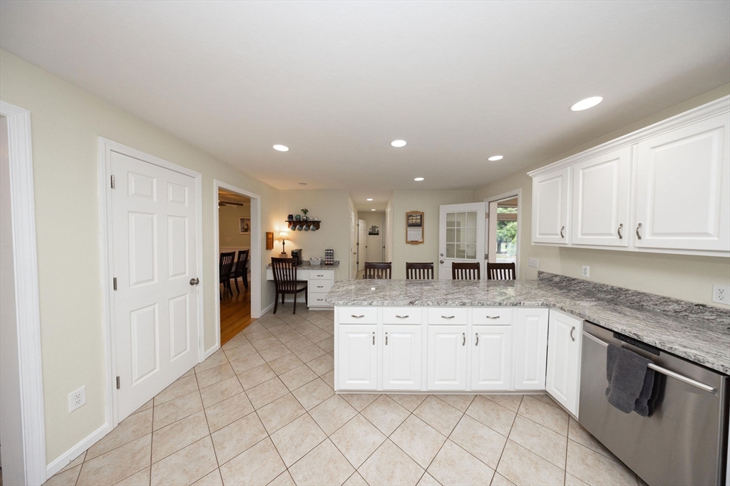 49 Dennis Whitney Road Oakham, MA 01068 - Photo 9 of 40 a kitchen with a sink and cabinets