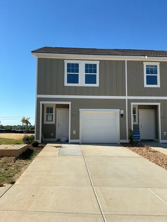 a front view of a house with a outdoor space