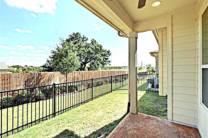 14001 Avery Ranch Boulevard, Unit 801 Austin, TX 78717 - Photo 19 of 26 An inviting covered patio offers a private outdoor retreat with a fenced yard.