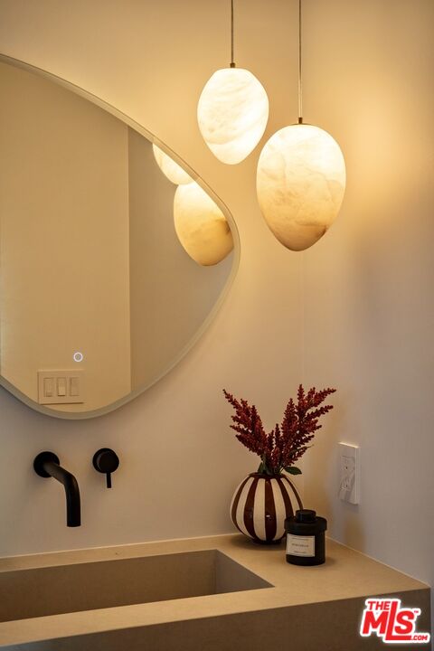 31376 Broad Beach Road Malibu, CA 90265 - Photo 16 of 32 a bathroom with a sink and mirror