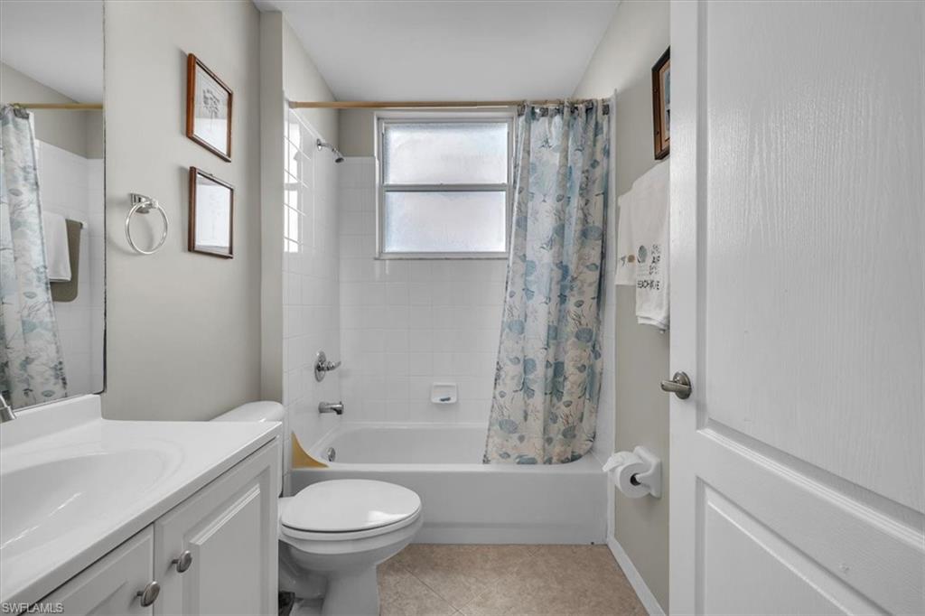 8075 Tiger Cove, Unit 1706 Naples, FL 34113 - Photo 26 of 50 Full bathroom with shower / tub combo, vanity, and light tile patterned floors