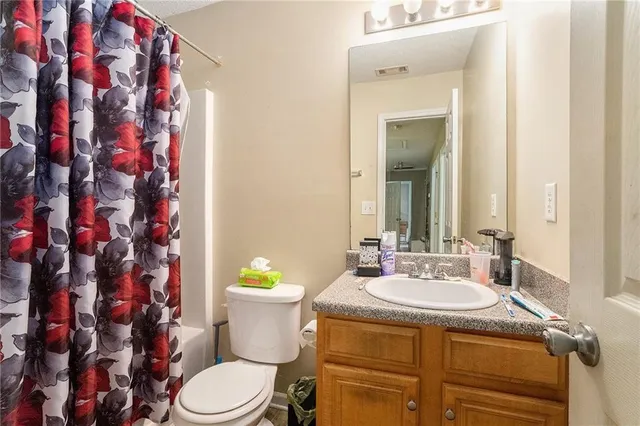 a bathroom with a sink and toilet