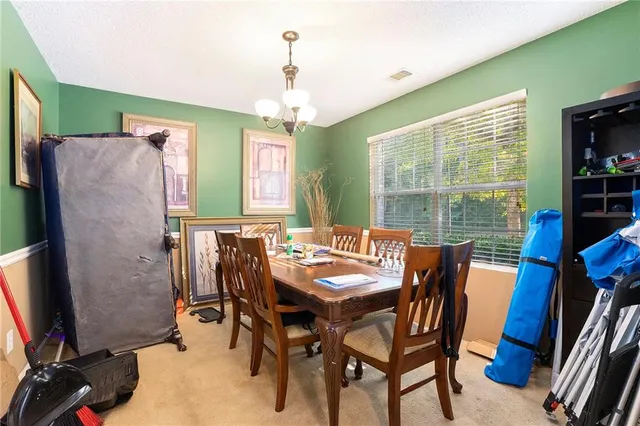 a dining room with furniture and window
