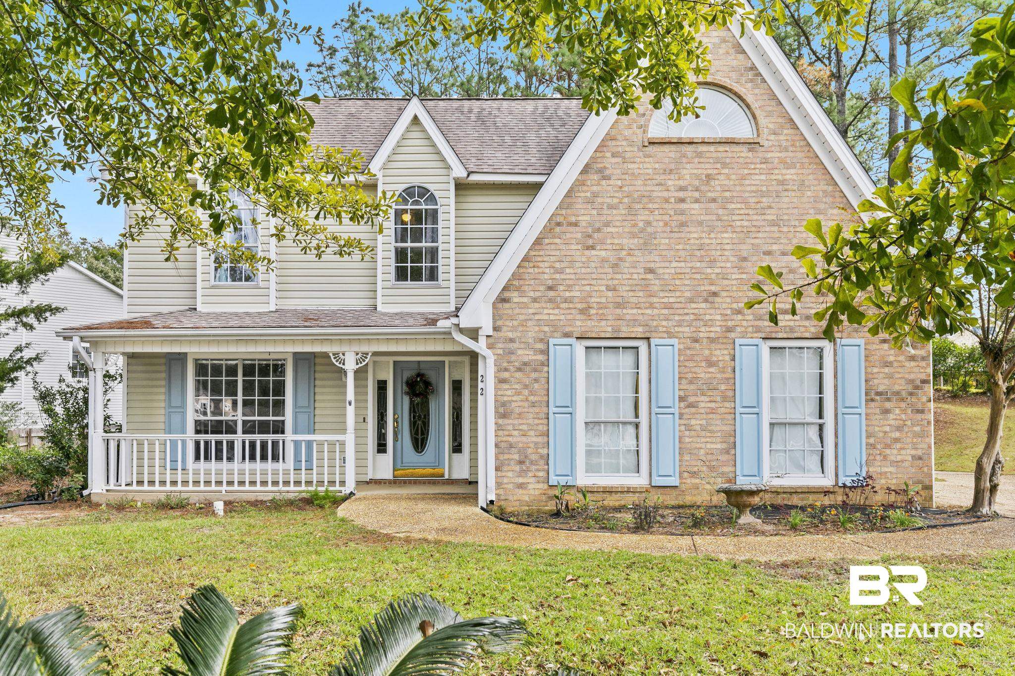 22 Pirates Lane Daphne, AL 36527 - Photo 1 of 36 View of front facade with covered porch and a front lawn