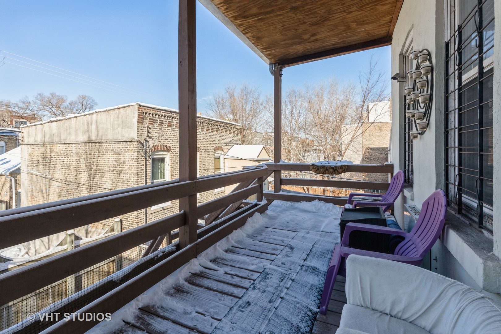 846 North Wolcott Avenue, Unit 2R Chicago, IL 60622 - Photo 12 of 12 a living room with furniture on the city view