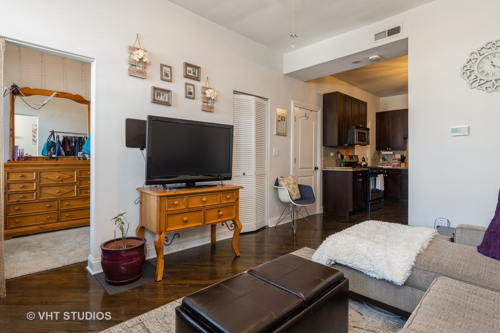 846 North Wolcott Avenue, Unit 2R Chicago, IL 60622 - Photo 4 of 12 a living room with furniture and a flat screen tv