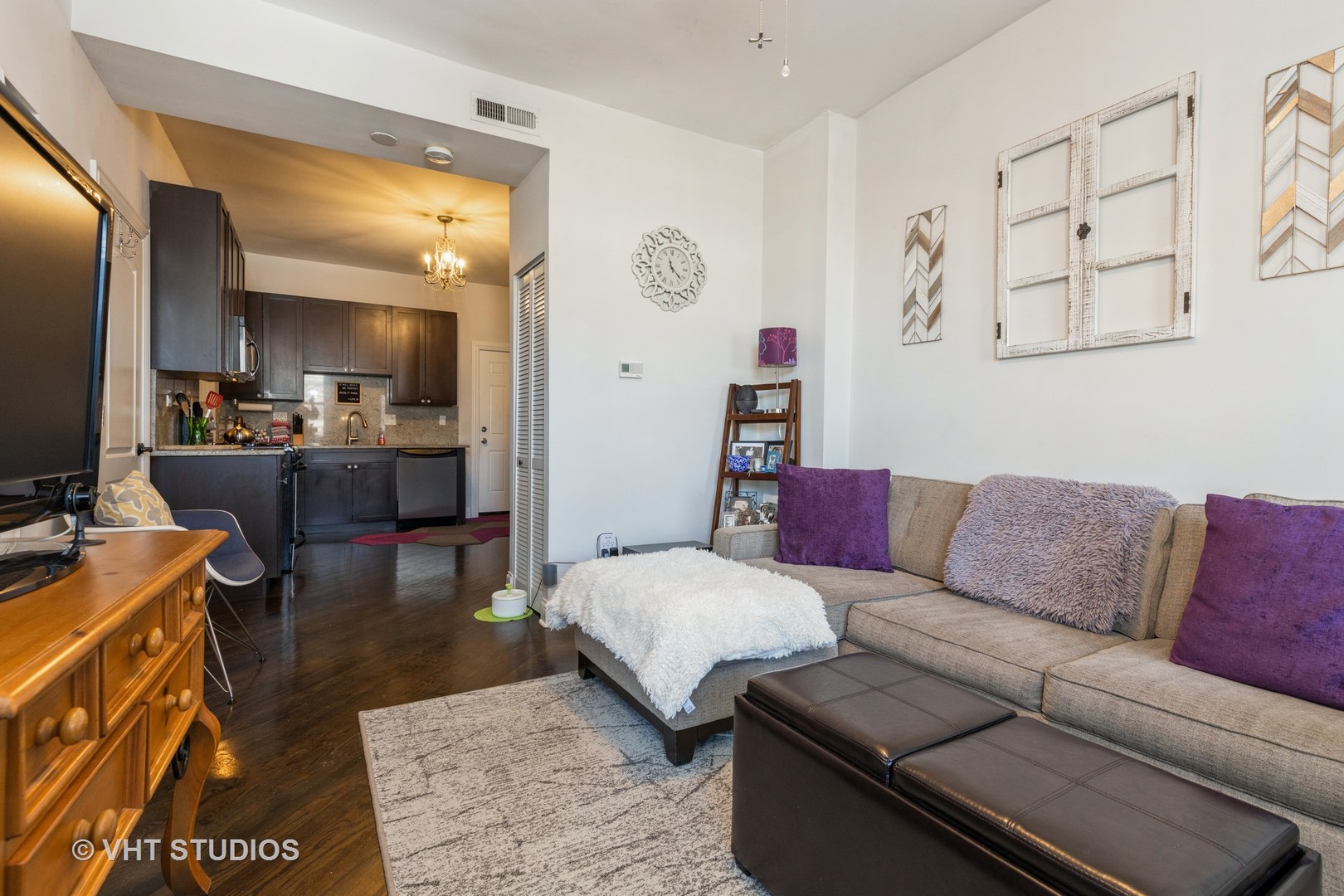 846 North Wolcott Avenue, Unit 2R Chicago, IL 60622 - Photo 5 of 12 a living room with furniture and a flat screen tv