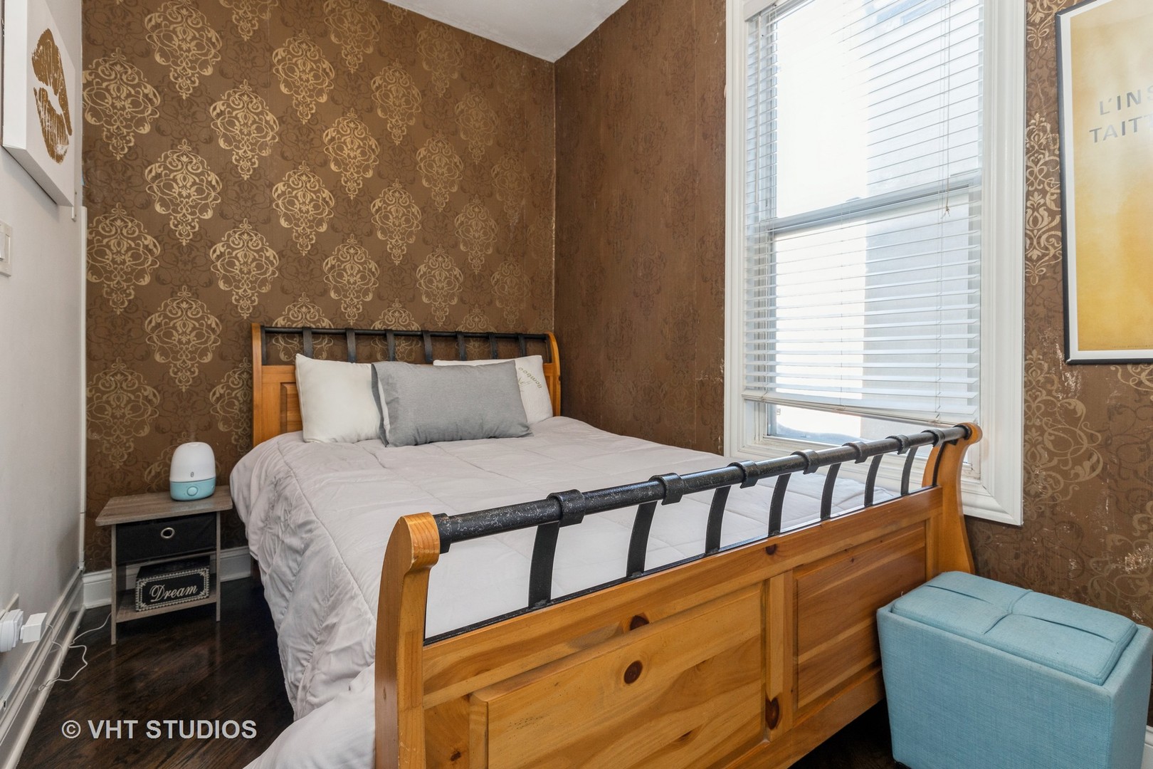 846 North Wolcott Avenue, Unit 2R Chicago, IL 60622 - Photo 9 of 12 a bedroom with a bed a dresser and a window