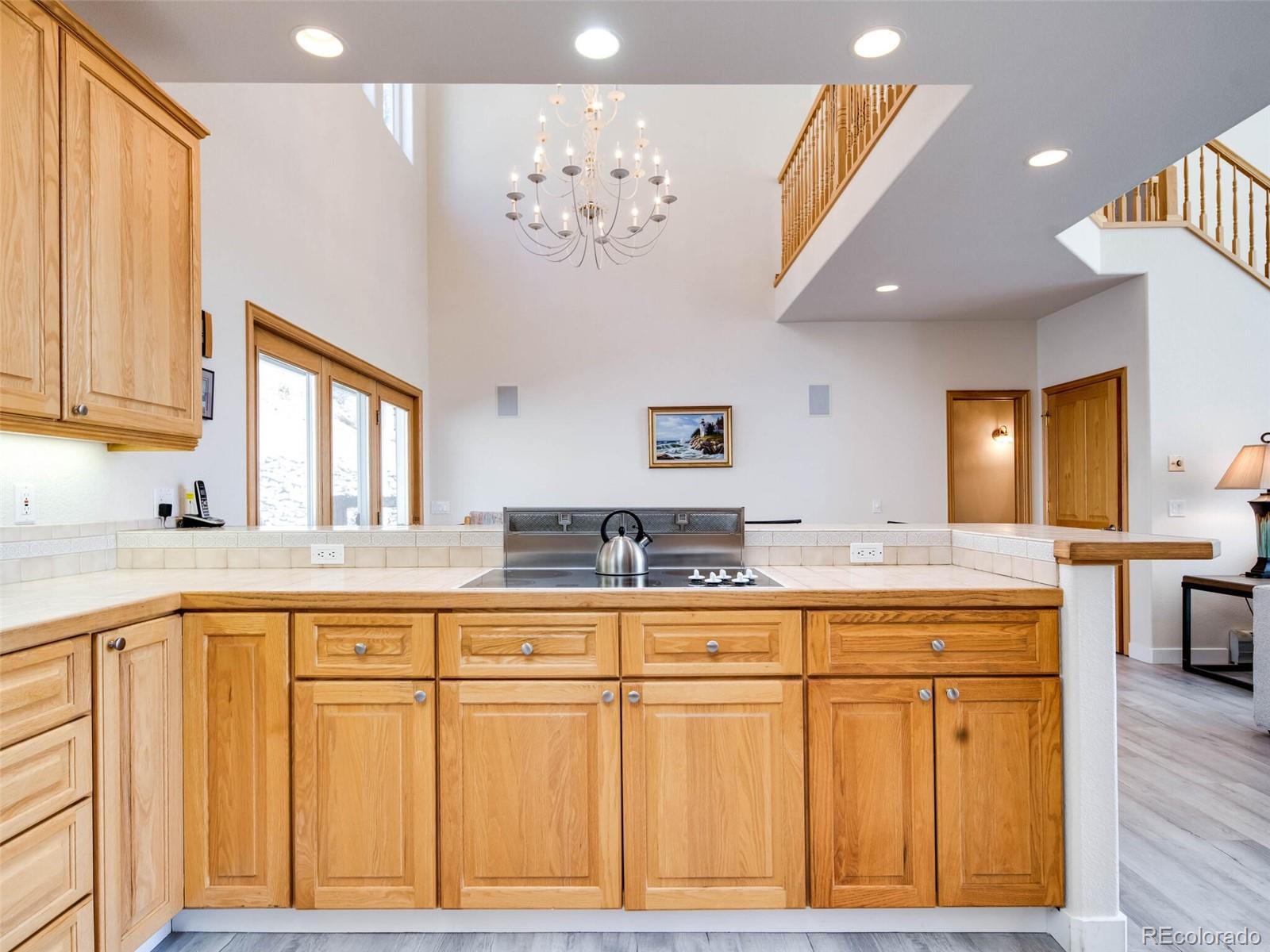 180 Nuthatch Road Evergreen, CO 80439 - Photo 14 of 40 a kitchen with cabinets and window