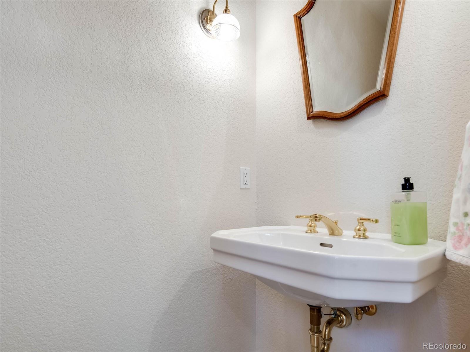 180 Nuthatch Road Evergreen, CO 80439 - Photo 20 of 40 a bathroom with a sink and mirror