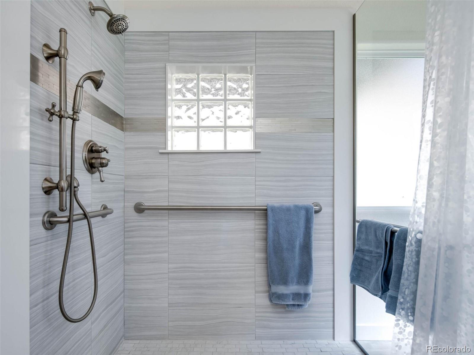 180 Nuthatch Road Evergreen, CO 80439 - Photo 26 of 40 a bathroom with a shower