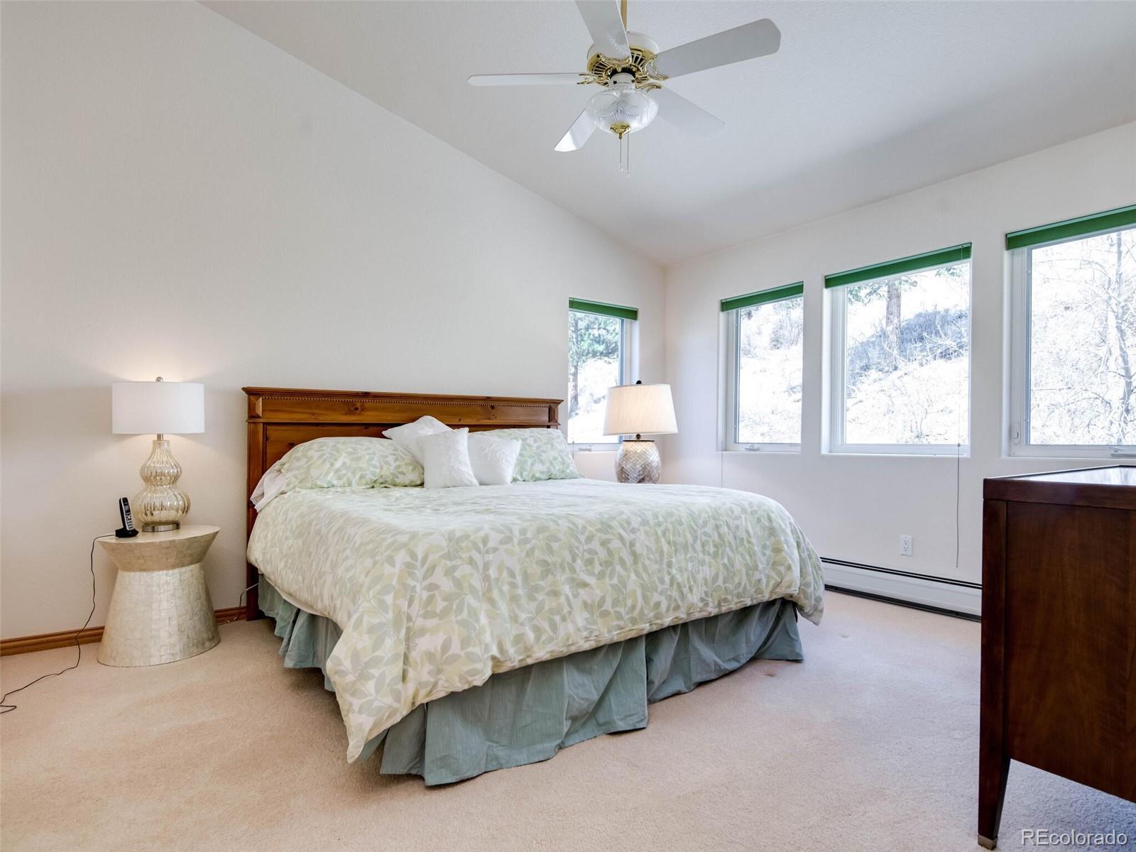 180 Nuthatch Road Evergreen, CO 80439 - Photo 38 of 40 a bedroom with bed and window