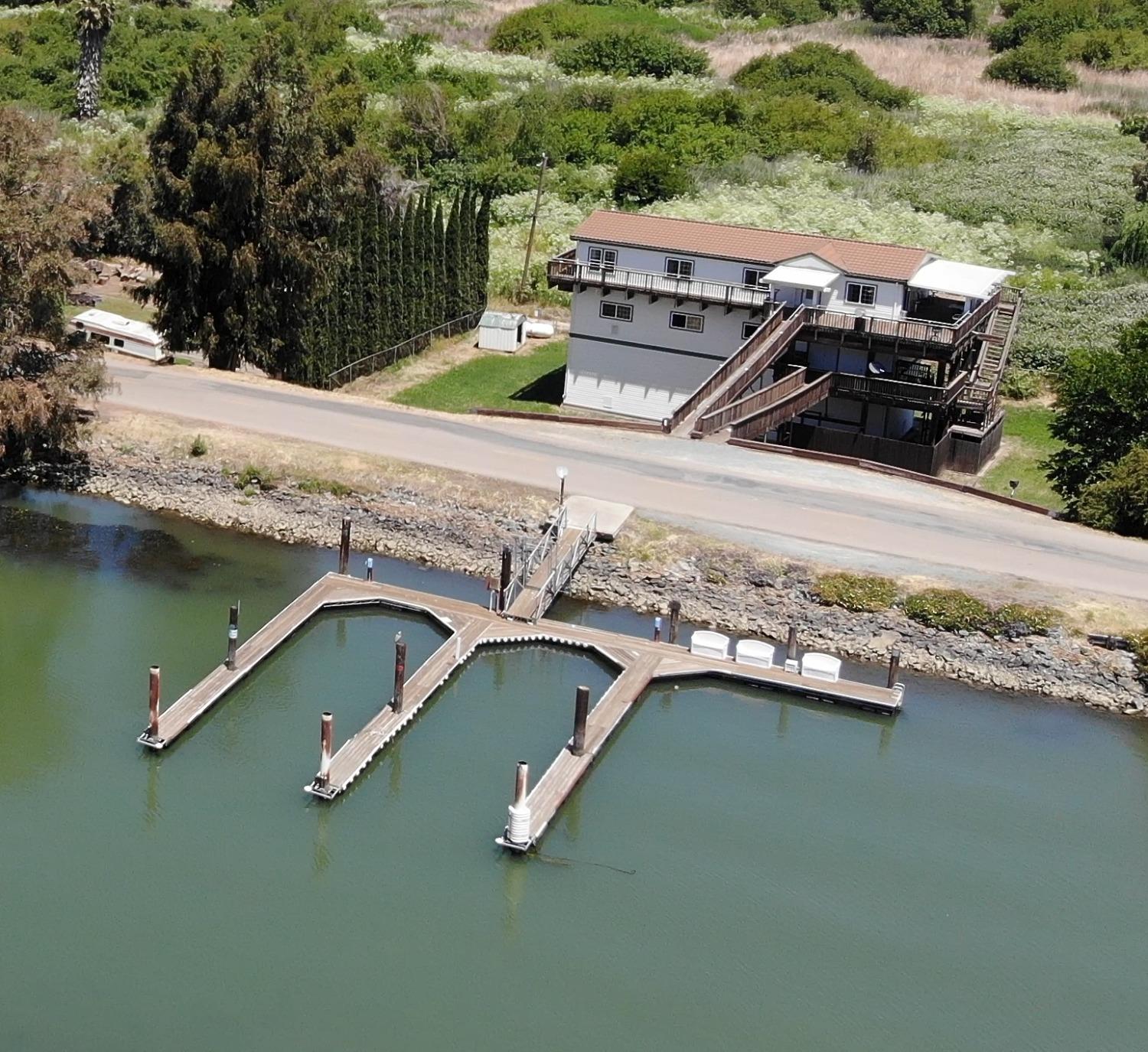 an aerial view of a house with a yard pool outdoor seating and yard