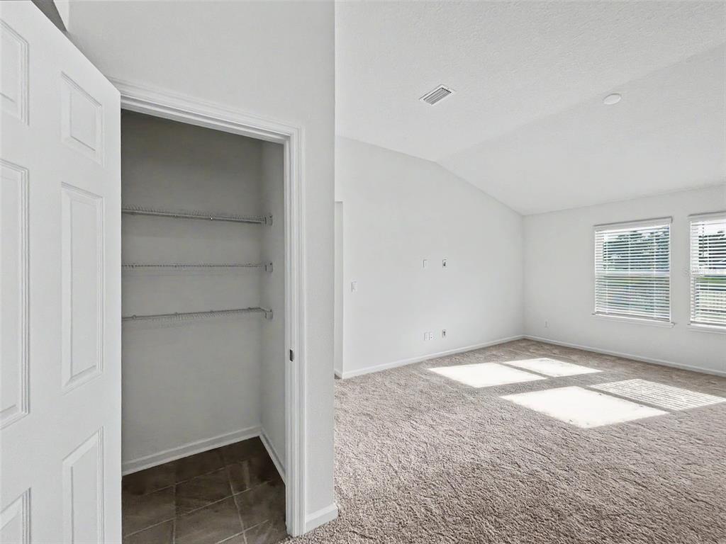 55 Signet Circle Flagler Beach, FL 32136 - Photo 13 of 39 a view of an empty room with a window