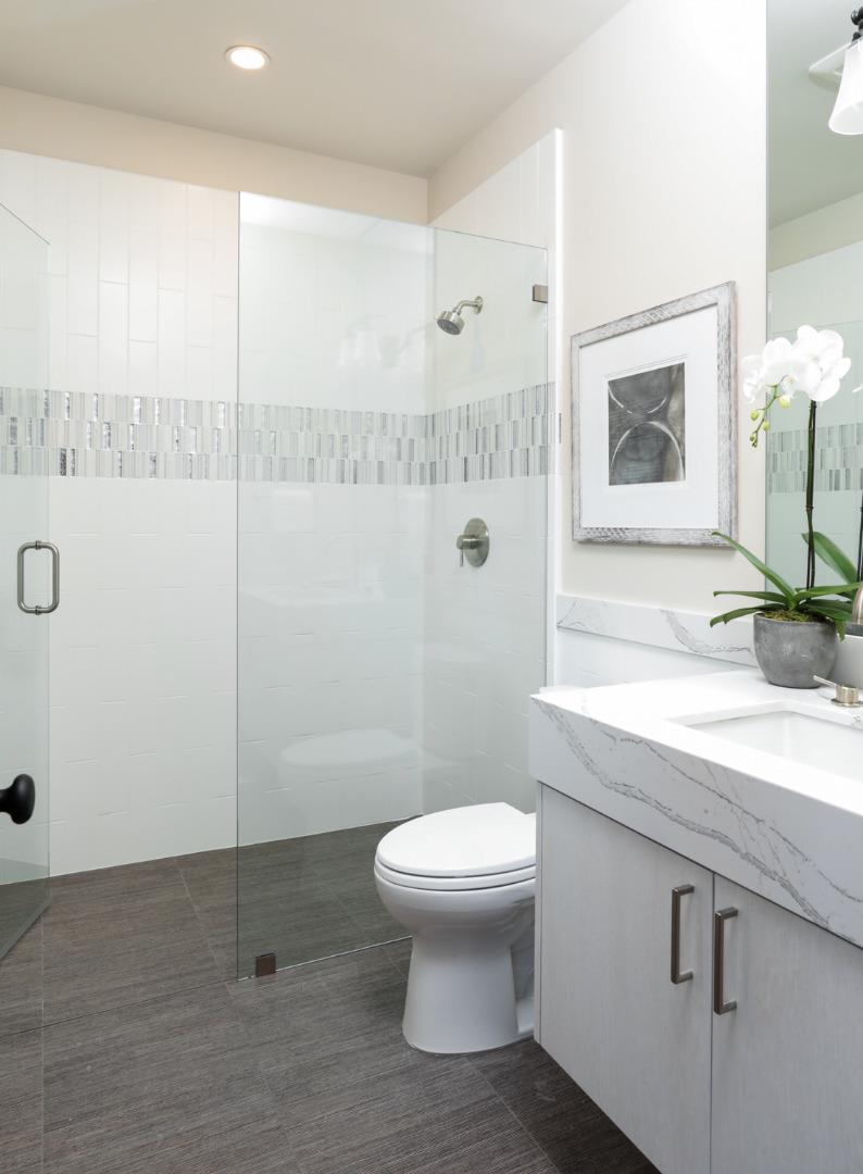 28 Bloomfield Road Burlingame, CA 94010 - Photo 17 of 27 a bathroom with a granite countertop sink mirror vanity and toilet