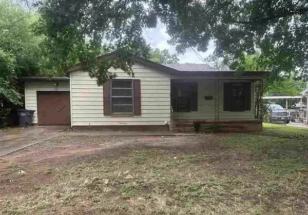 a view of a house with a yard and garage