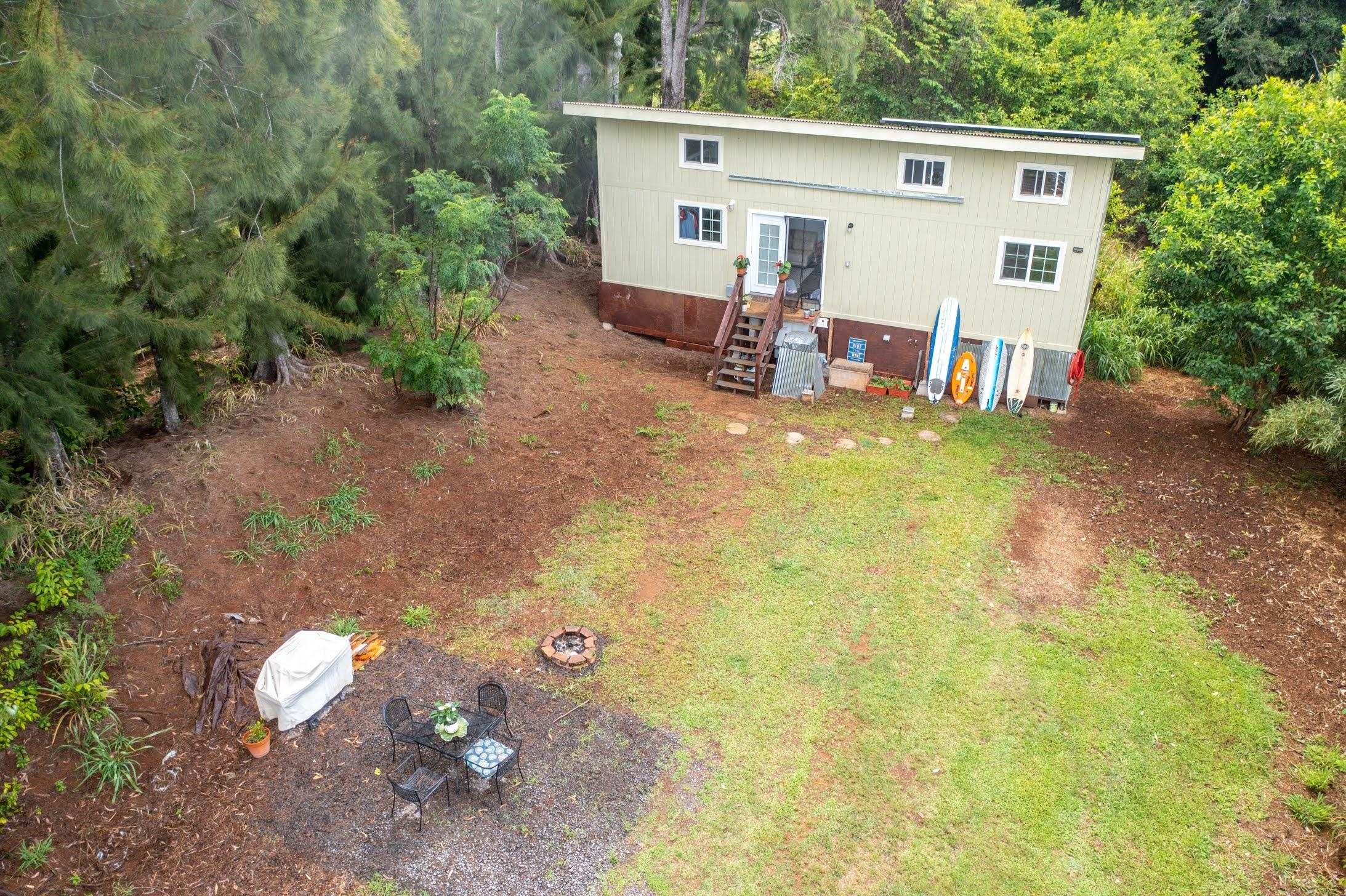 1740 Kokomo Road, Unit B Haiku, HI 96708 - Photo 11 of 29 a view of a backyard with a patio