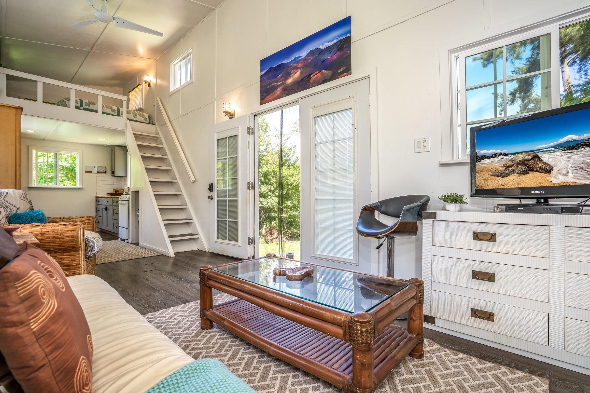 1740 Kokomo Road, Unit B Haiku, HI 96708 - Photo 20 of 29 a living room with furniture and a window