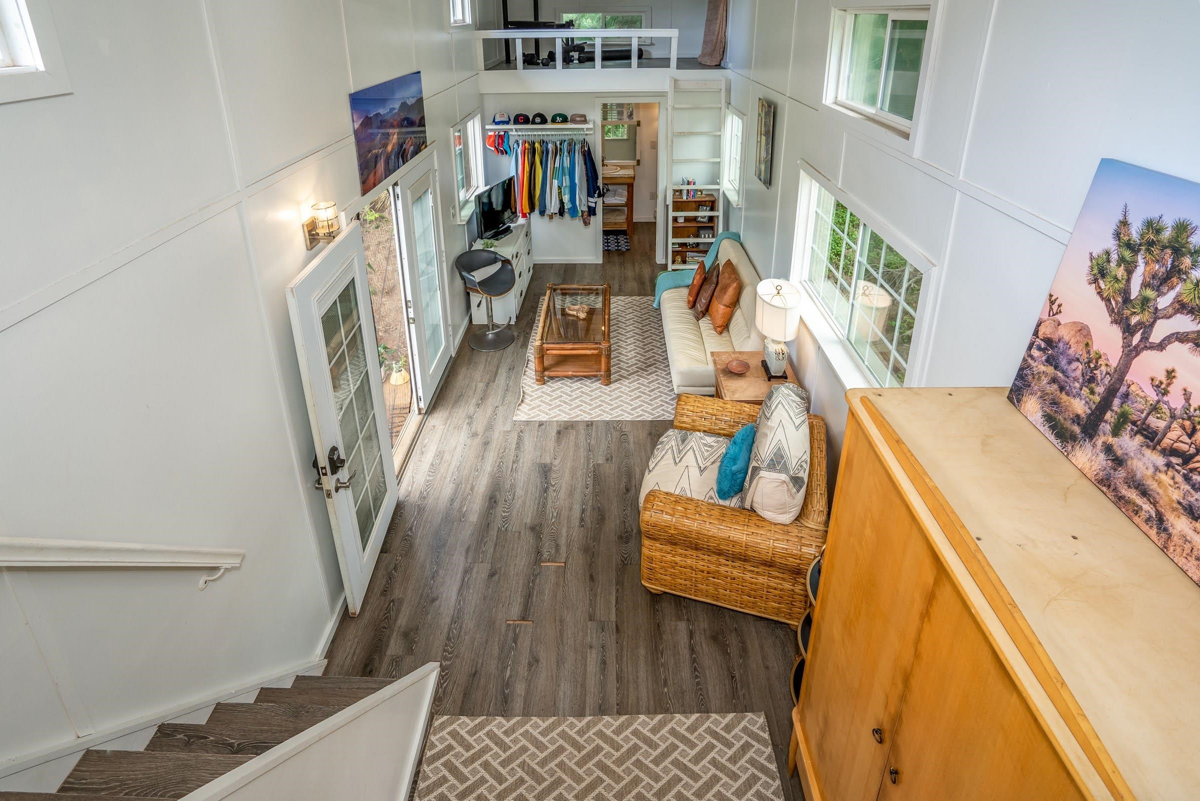 1740 Kokomo Road, Unit B Haiku, HI 96708 - Photo 25 of 29 a living room with furniture and a floor to ceiling window