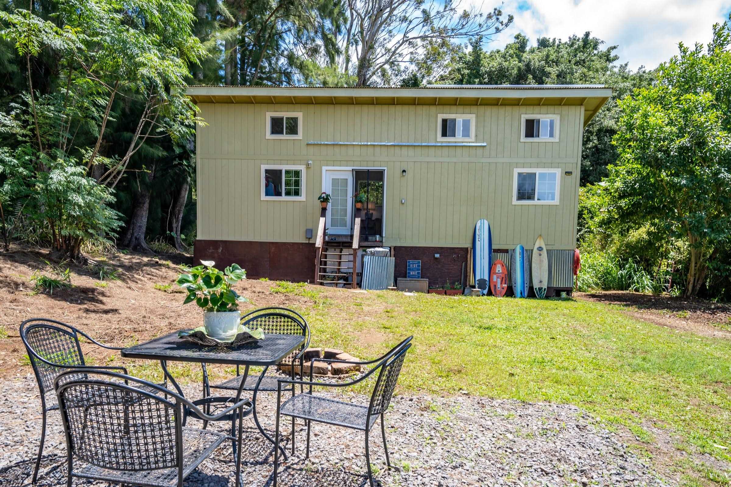 1740 Kokomo Road, Unit B Haiku, HI 96708 - Photo 29 of 29 a view of a house with backyard and sitting area
