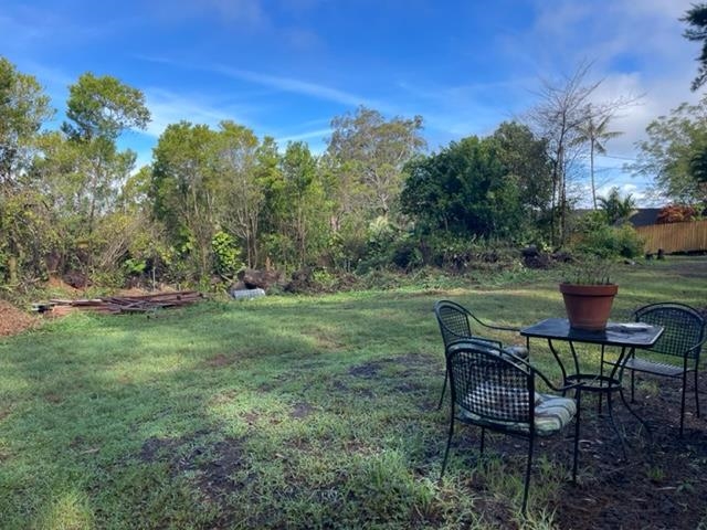 1740 Kokomo Road, Unit B Haiku, HI 96708 - Photo 5 of 29 a view of a chairs and table in the yard