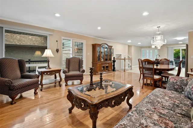a living room with furniture a rug and a table